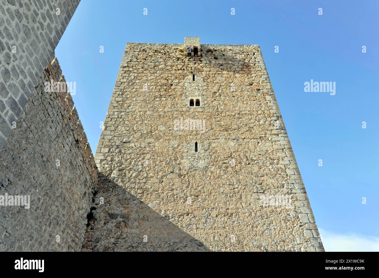 Jaen, Castillo de Santa Catalina on Jaen, View of an old stone defence defence tower in front of a clear sky, Jaen, Baeza, Ubeda, Andalusia, Spain Stock Photo