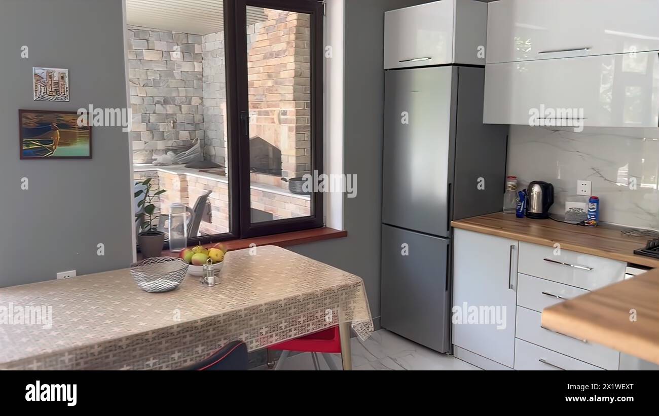 Interior of a modern kitchen with granite countertop and grey wall ... - Grey Stone Kitchen Wall Design With Sliding Doors