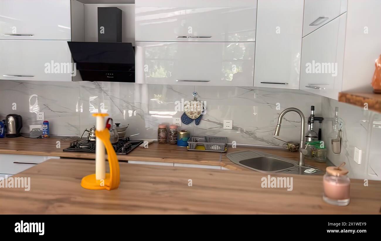 Interior of a modern kitchen with a sink and countertop Stock Photo - Alamy