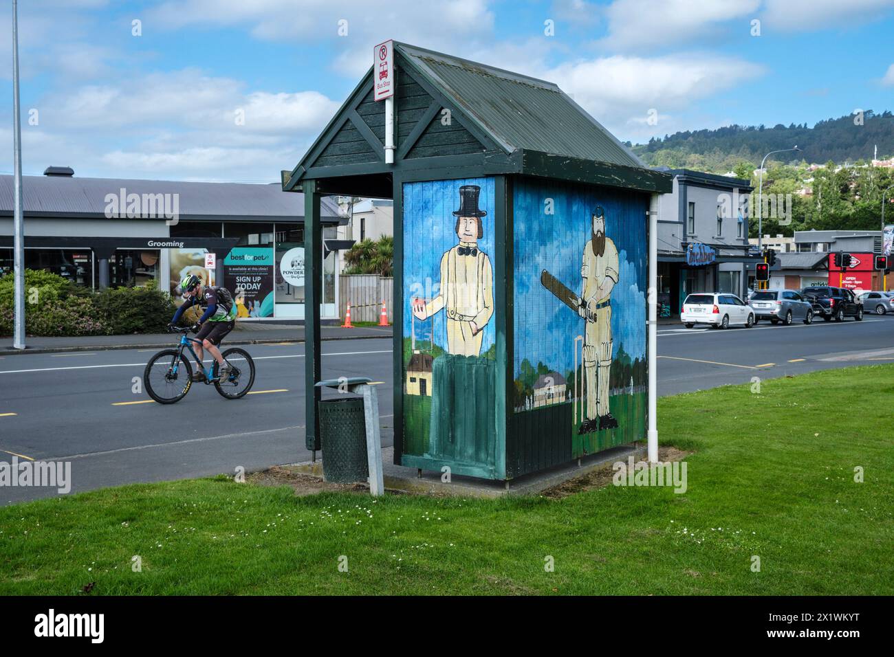 A bus shelter decorated with a mural of Victorian cricketers, Bank Street, Dunedin, Otago, South Island, New Zealand Stock Photo