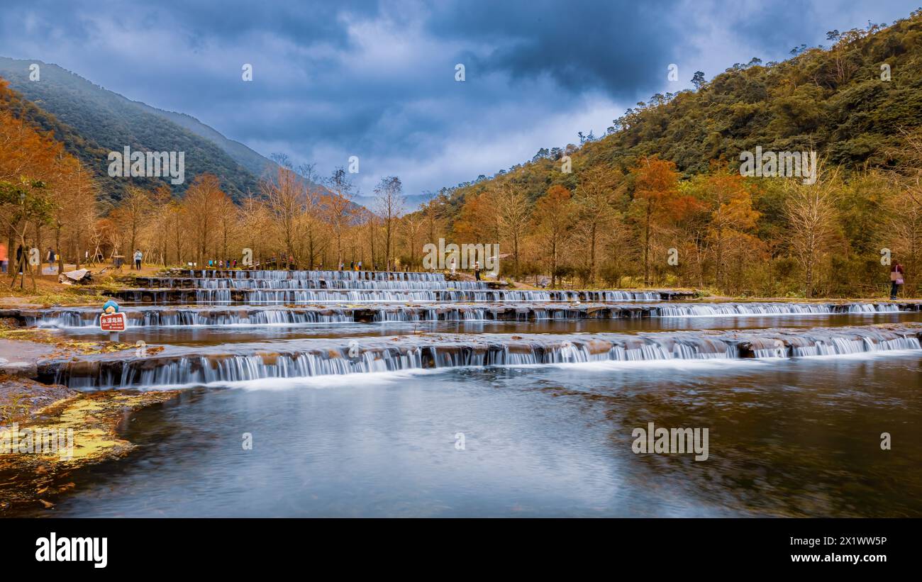 Popular autumn scenery of a private theme garden with cypress trees around artificial terraced ponds in the mountainous area of Ilan in northern Taiwa. Stock Photo