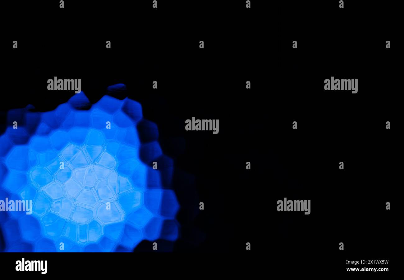 Blue Polygonal Shape on black background. Honeycomb pattern. Stock Photo