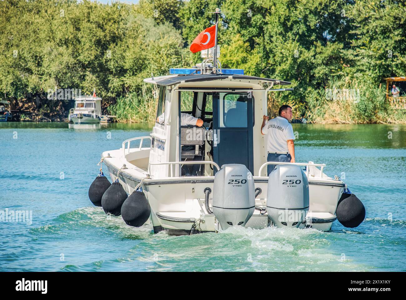 Dalyan, Turkey - September 13 2015: Gendarmerie speedboat cruises the river with officers aboard, ensuring safety and order Stock Photo