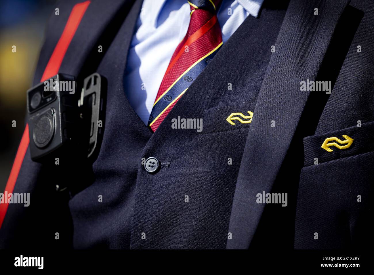 ILLUSTRATIVE - A conductor with a bodycam on the platform of Utrecht ...