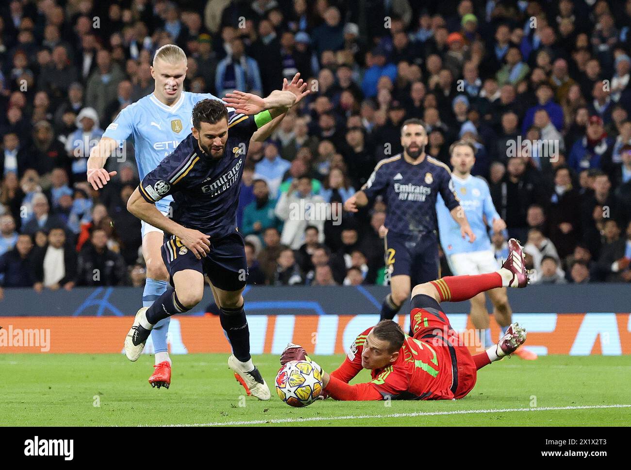 Etihad Stadium, Manchester, UK. 17th Apr, 2024. Champions League Football, Quarter Final, Manchester City versus Real Madrid; Andriy Lunin of Real Madrid dives to make a save Credit: Action Plus Sports/Alamy Live News Stock Photo