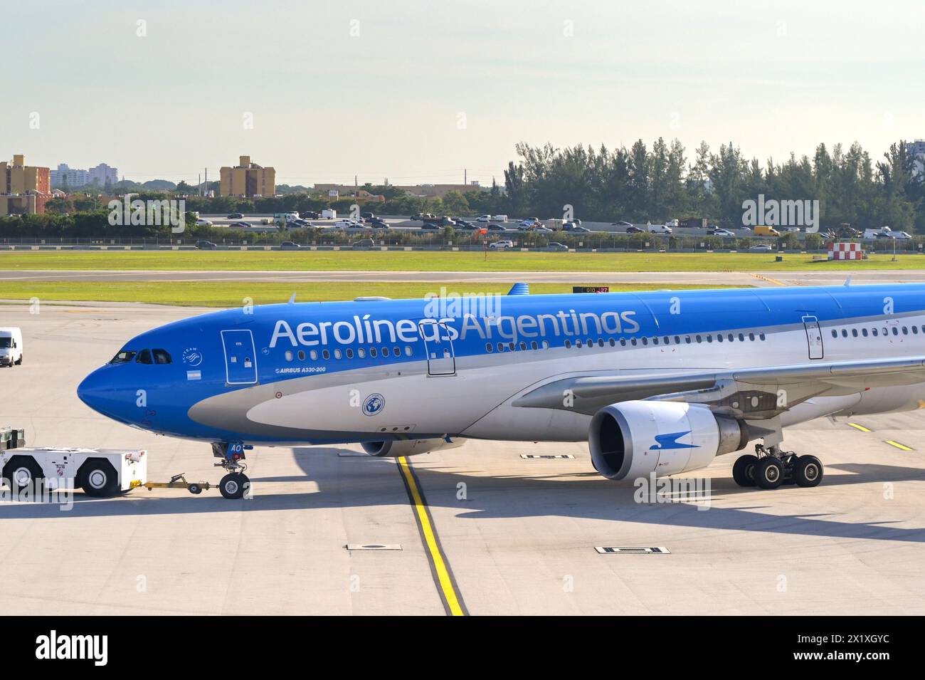 Miami, Florida, USA - 5 December 2023: Airbus A330 jet operated by Aerolineas Argentinas being towed to one of the terminals at Miami airport Stock Photo