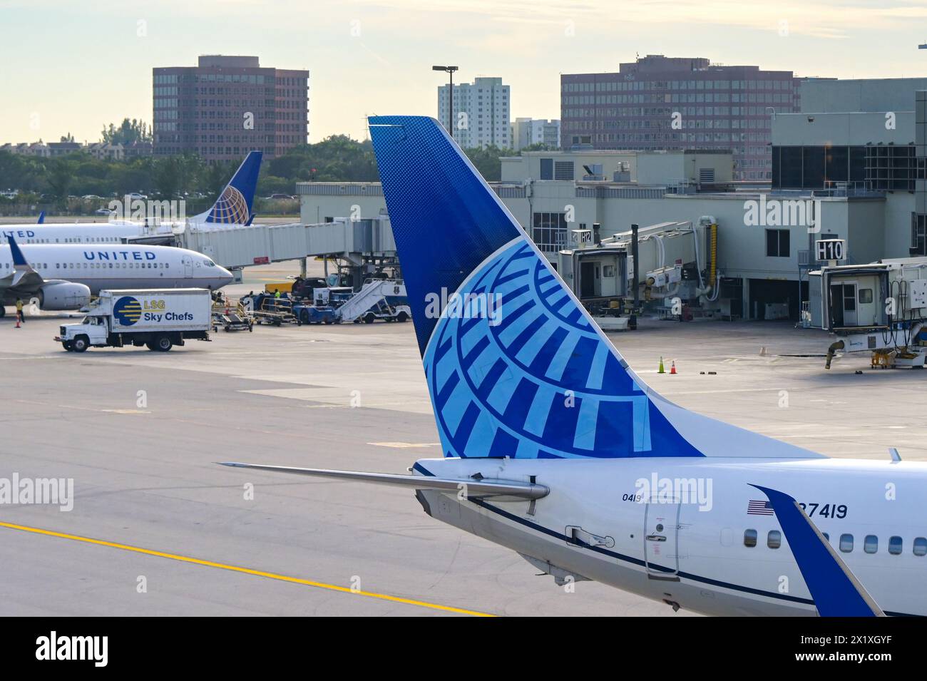 Miami, Florida, USA - 5 December 2023: Tail fin of a Boeing 737 jet operated by United Airlines at Miami International Airport. Stock Photo