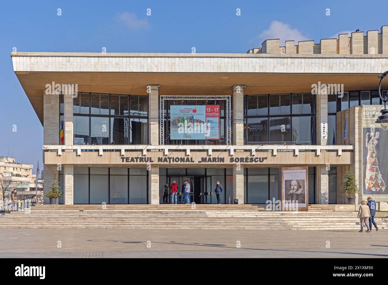 Craiova, Romania - March 16, 2024: National Theatre Marin Sorescu Building at Alexandru Ioan Cuza Street at Sunny Spring Day. Stock Photo