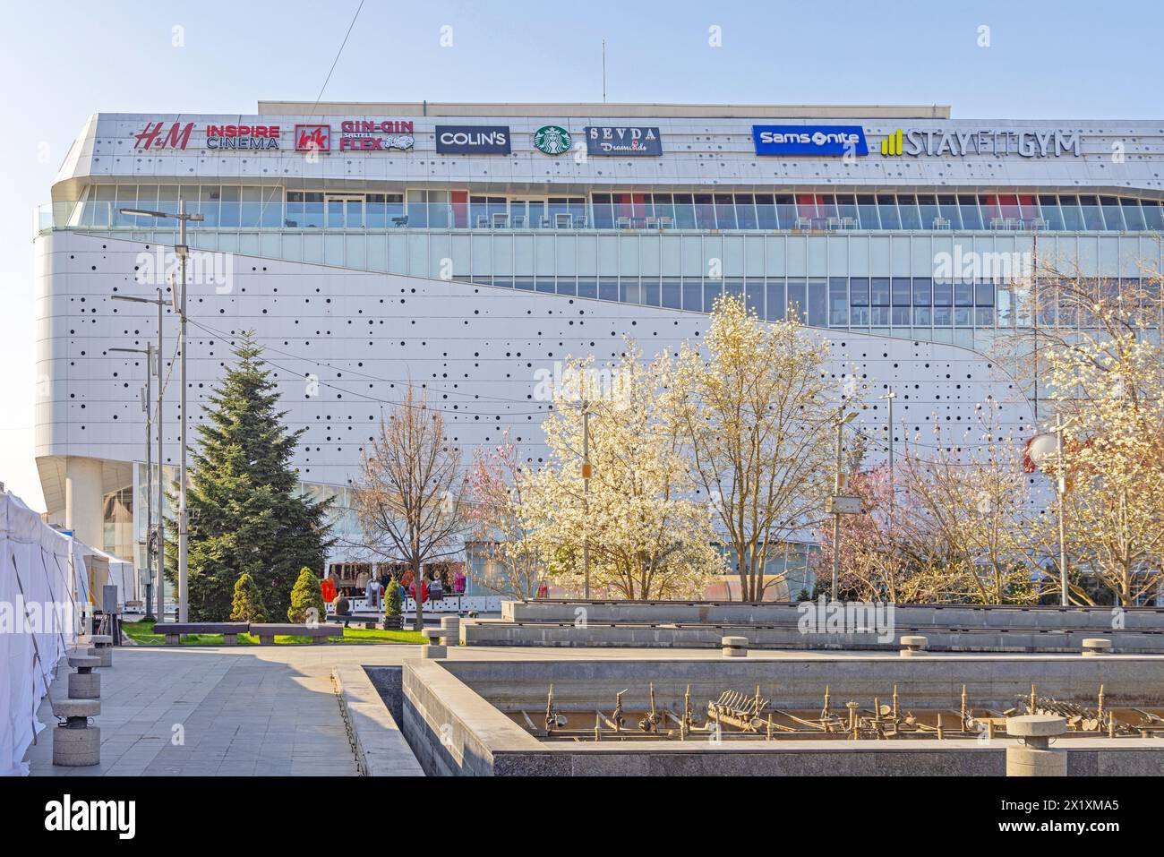 Craiova, Romania - March 16, 2024: Brand Name Logo Signs at Top of Mercur Center Modern Shopping Mall Building Spring Day. Stock Photo