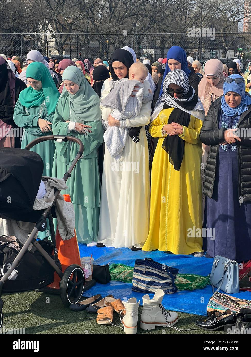 Muslims come together for Prayer at the Parade Grounds by Prospect Park after the month of Ramadan on Eid al-Fitr in Brooklyn, New York. Stock Photo