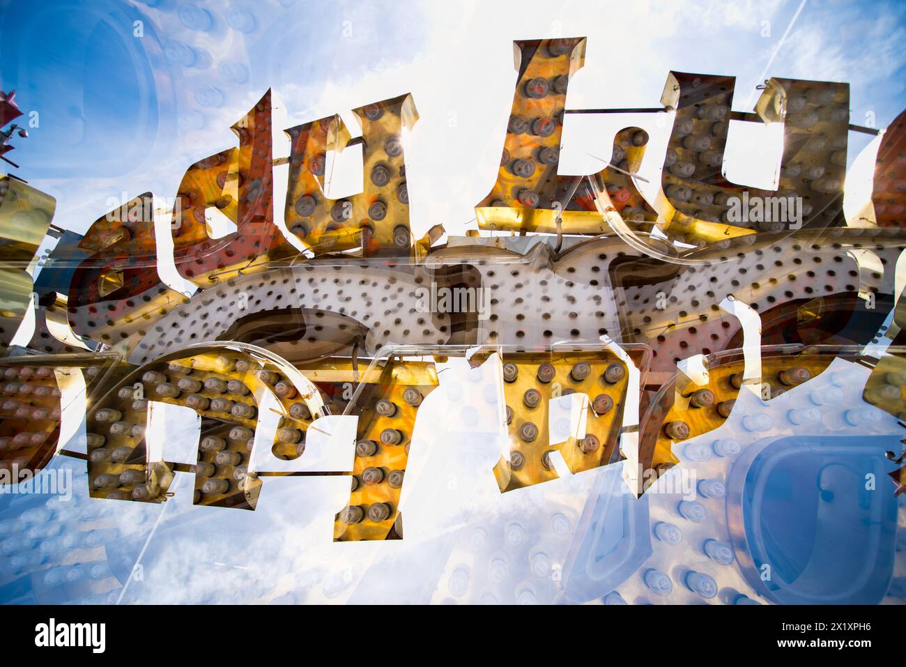 Double exposure of abandoned and discarded neon Lucky sign in the Neon Museum aka Neon boneyard in Las Vegas, Nevada. Stock Photo