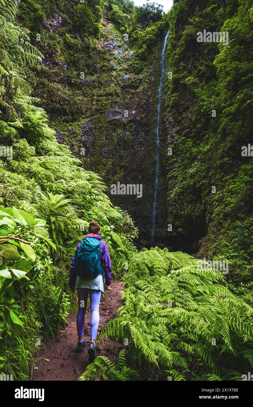 description-backpacker-toursit-hikes-to-a-big-scenic-waterfall