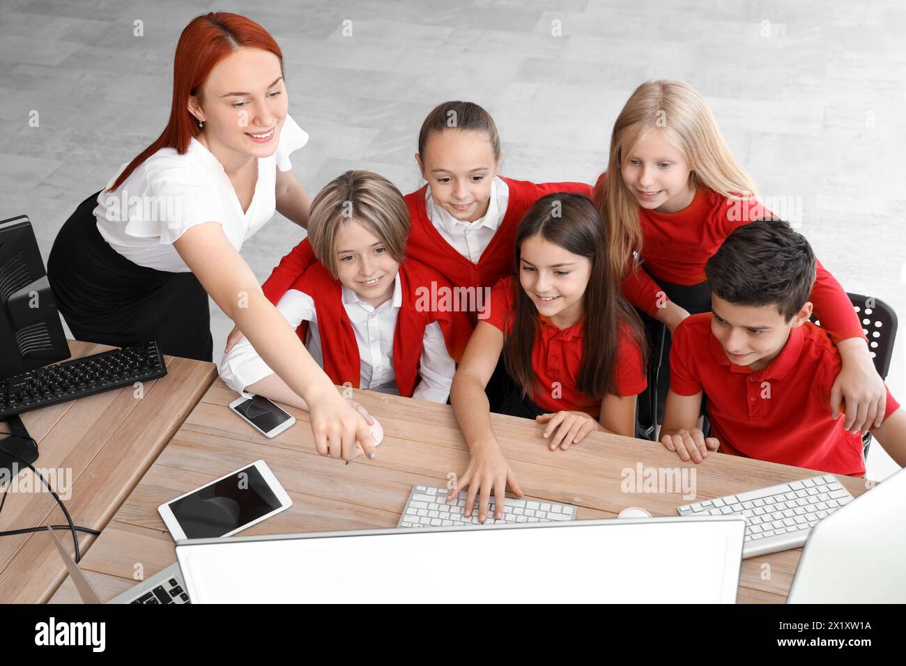 Little children with teacher studying at school computer lab Stock ...