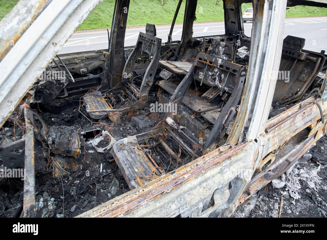 interior seating of burnt out range rover by the side of the road in ...