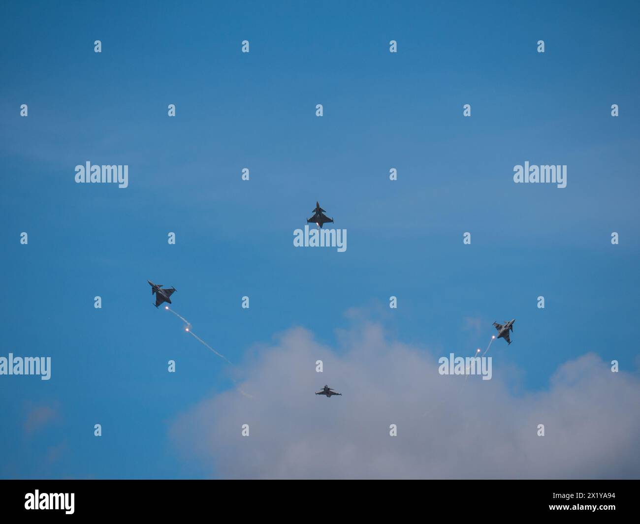 Swedish Airforce air show on F16 Ärna airfield, Uppsala Sweden. Four Swedish fighter jets JAS 39 Gripen flying in close and perfect combat formation. Stock Photo