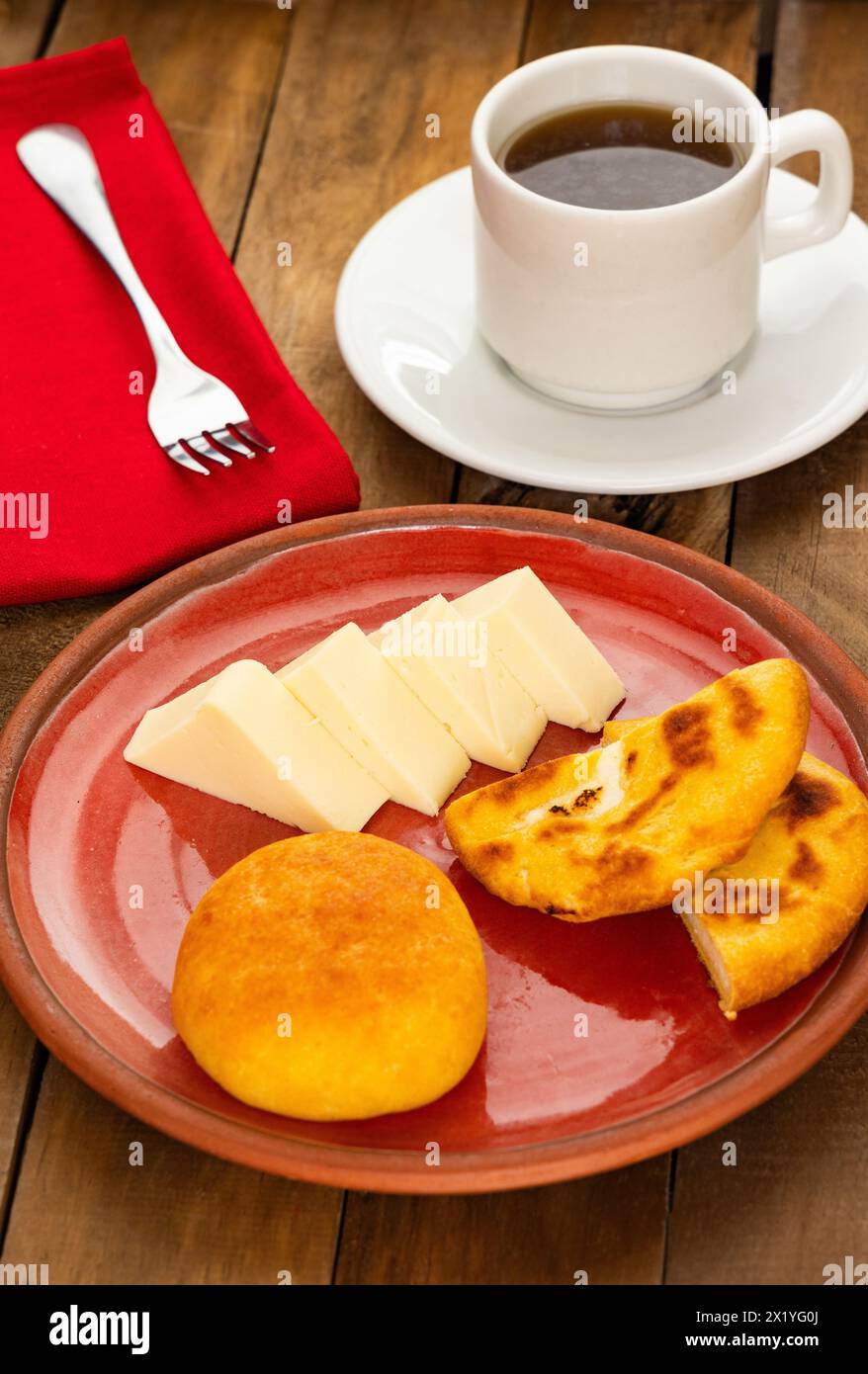 Arepa, almojabana, cheese and hot aguapanela - Typical Colombian breakfast Stock Photo