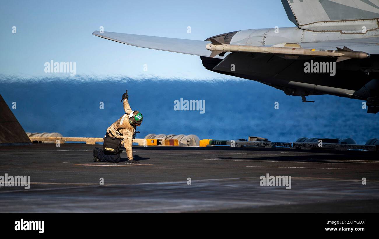 USS Theodore Roosevelt, United States. 17th Apr, 2024. U.S. Navy sailor AME 2nd Class Carl Barr gives his okay for the launch of a F/A-18E Super Hornet fighter aircraft on the flight deck of the Nimitz-class aircraft carrier USS Theodore Roosevelt underway conducting routine operations, April 17, 2024, on the Philippine Sea. Credit: MC3 Adina Phebus/U.S Navy Photo/Alamy Live News Stock Photo