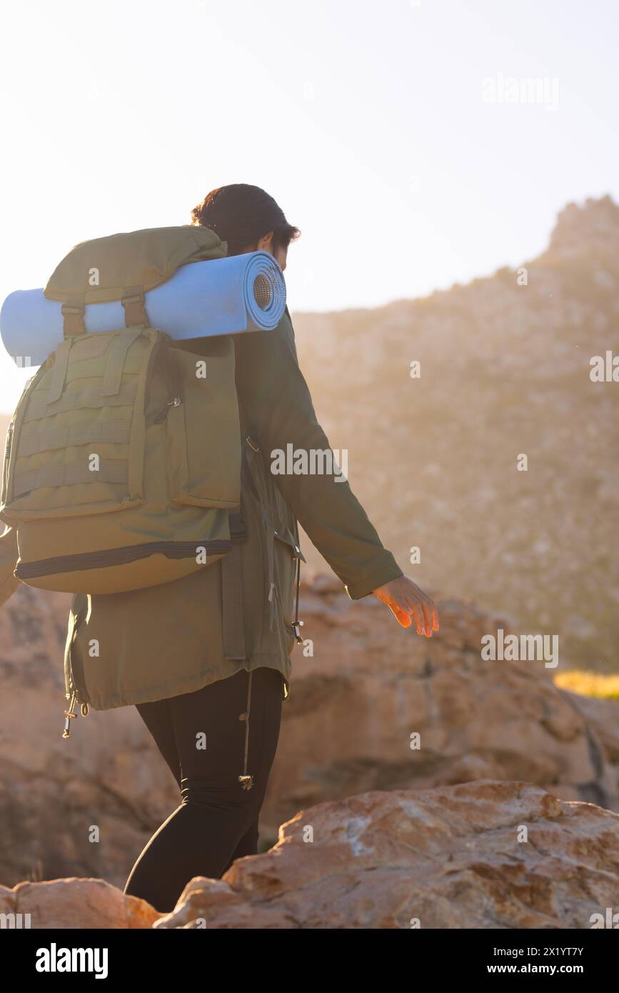 Female hiker climbing rock hi-res stock photography and images - Alamy