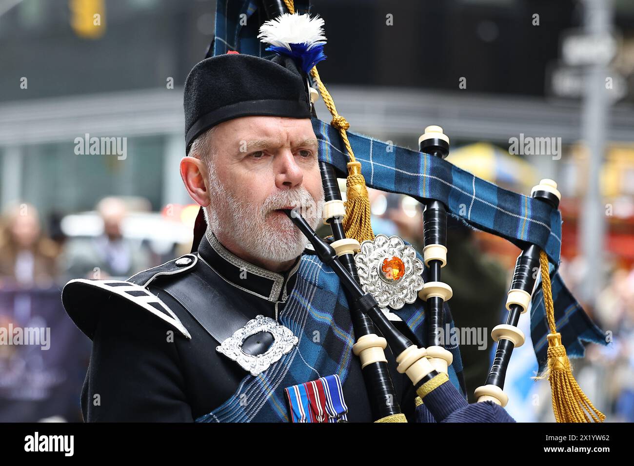 The Shamrock Pipes and Drums band performs during the Tartan Day Parade