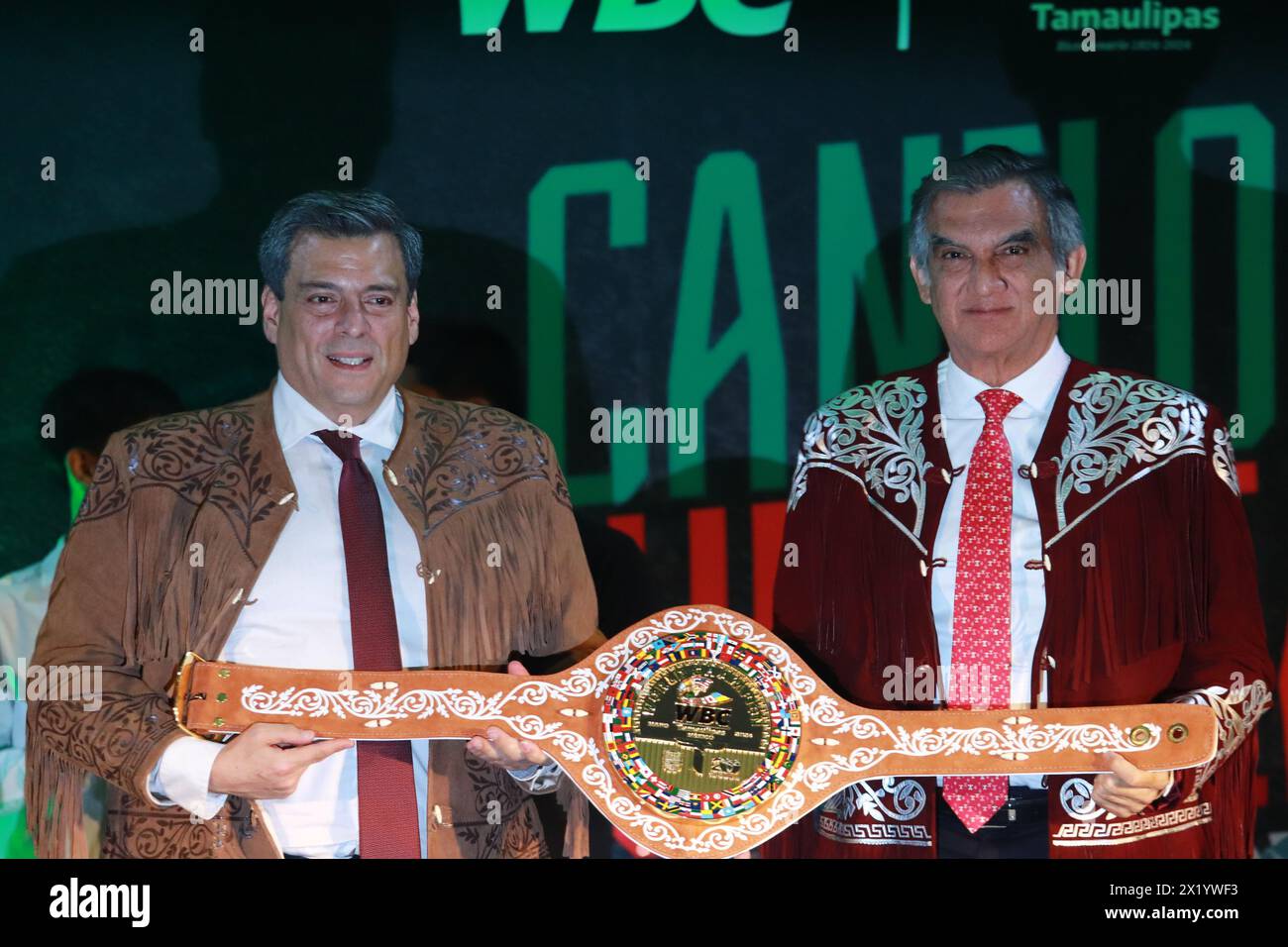 Mexico City, Mexico. 18th Apr, 2024. President of the World Boxing Council (WBC), Mauricio Sulaiman (L), accompanied by the Governor of Tamaulipas, Américo Villareal, show the commemorative boxing belt, during a press conference of the fight between Saúl 'Canelo' Álvarez and Jaime Munguia. on April 18, 2024, in Mexico City. (Photo by Carlos Santiago/ Eyepix Group/Sipa USA) Credit: Sipa USA/Alamy Live News Stock Photo