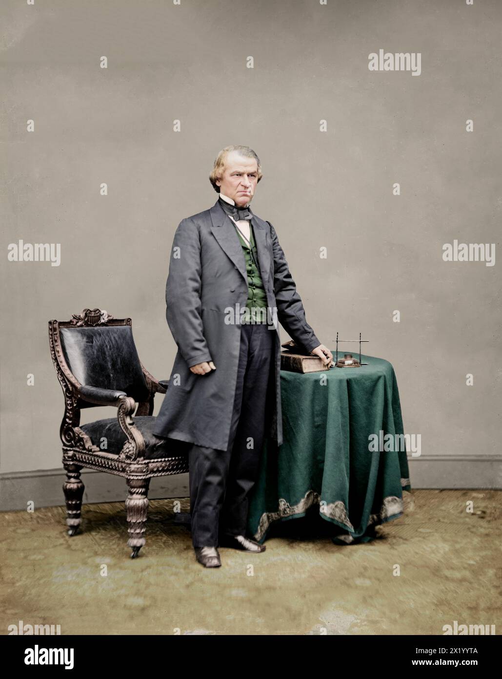 Andrew Johnson, full-length portrait, standing, facing right, with table and chair. Between 1865 and 1880. By Mathew Brady. Stock Photo