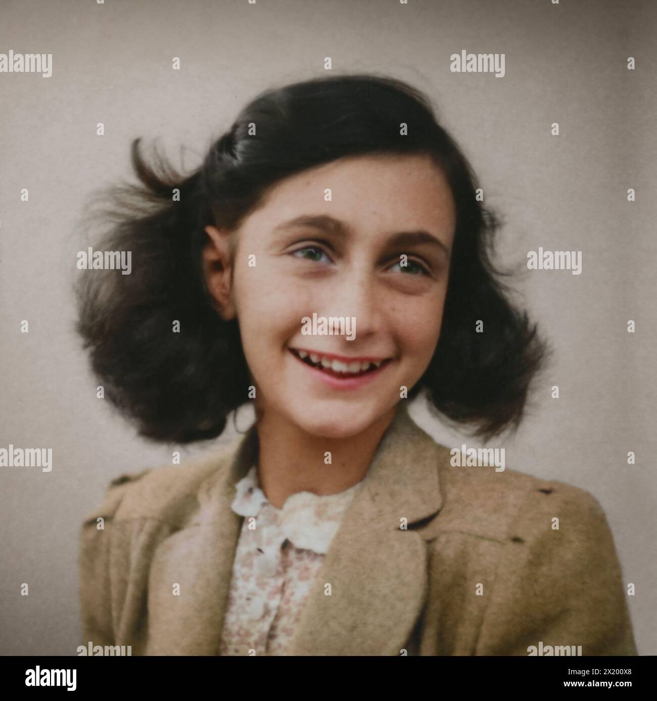 Passport photo of Anne Frank from a photo album, age 13, taken at Polyfoto in Amsterdam in May 1942. Material: Photo paper. Stock Photo