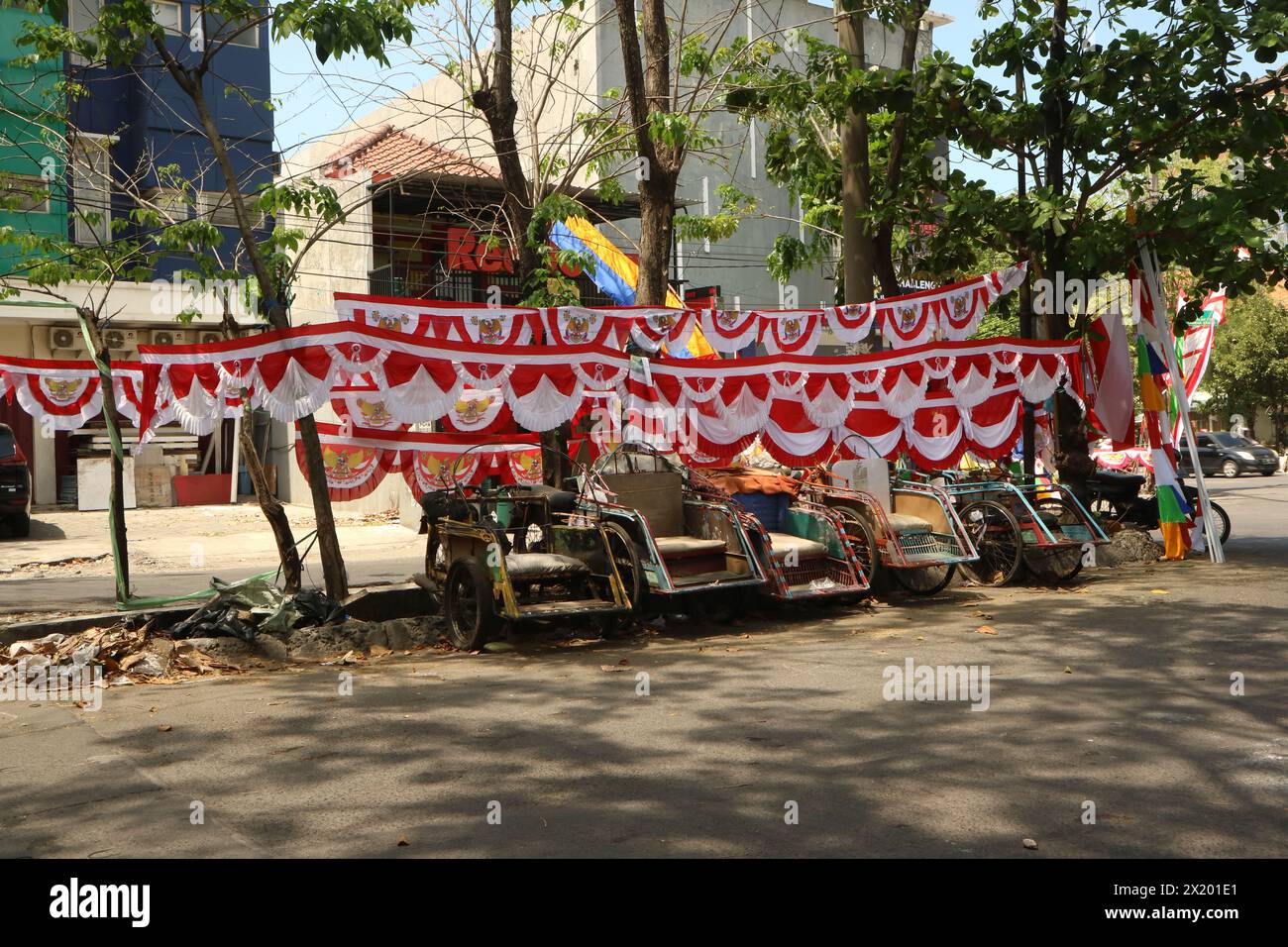 Flag vendors sell at a pedestrian street. This flags usually used as decoration during Indonesia independence day commemoration. Stock Photo