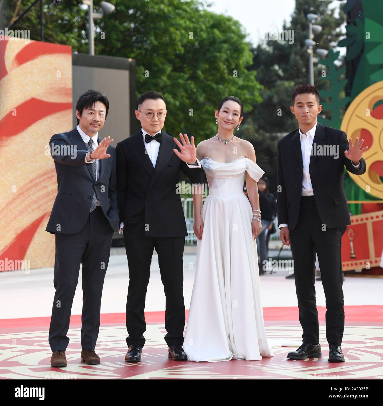 (240419) -- BEIJING, April 19, 2024 (Xinhua) -- Director Gao Peng (2nd L), actress Qin Hailu (2nd R), actor Zu Feng (1st L) and Zhou Zhengjie attend the opening of the 14th Beijing International Film Festival (BJIFF) in Beijing, capital of China, April 18, 2024. The 14th BJIFF kicked off on Thursday in the Chinese capital, welcoming filmmakers from home and abroad to discuss movie development and promote cultural exchanges in the industry.  Members of 14th Tiantan Award jury of this year's BJIFF, led by Serbian director Emir Kusturica as jury president, appeared at the opening ceremony.   A to Stock Photo