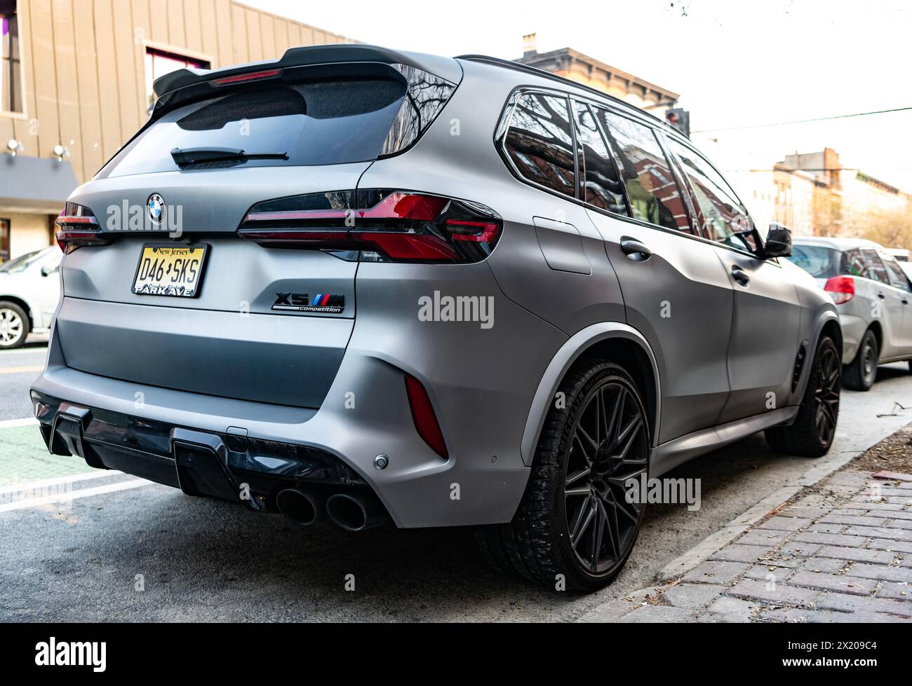 New York City, USA - March 15, 2024: BMW X5 modern grey car parked outside, corner view. Stock Photo