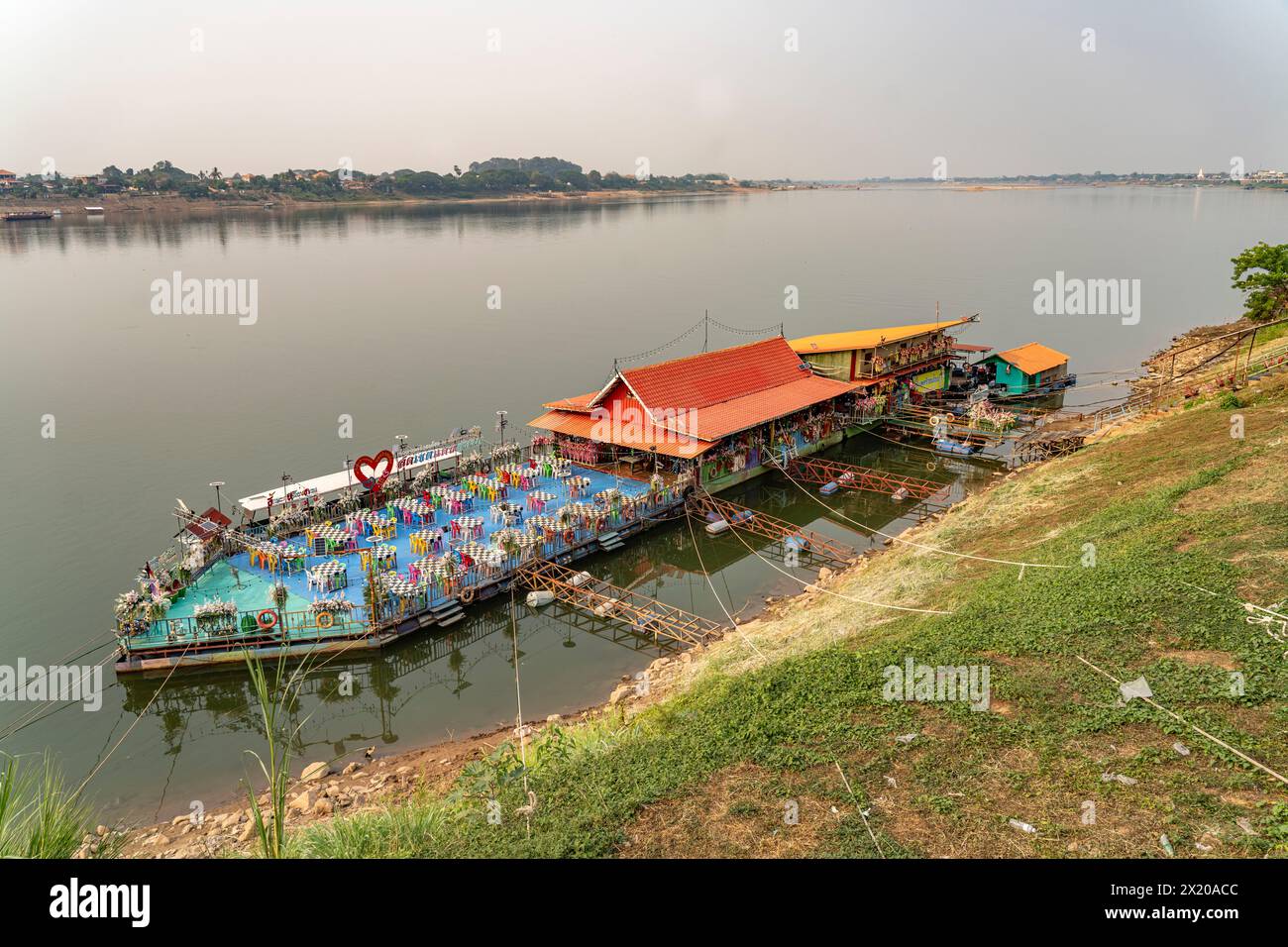 Floating restaurant on the Mekong and the Mekong bank in Nong Khai and Laos, Thailand, Asia Stock Photo
