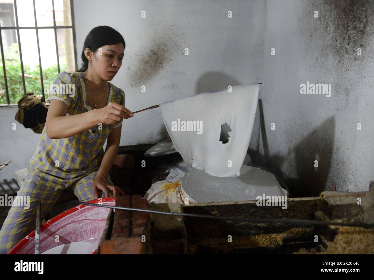 Traditional rice noodle production in a small family business on Cam Kim Island, Hoi An, Vietnam. Stock Photo