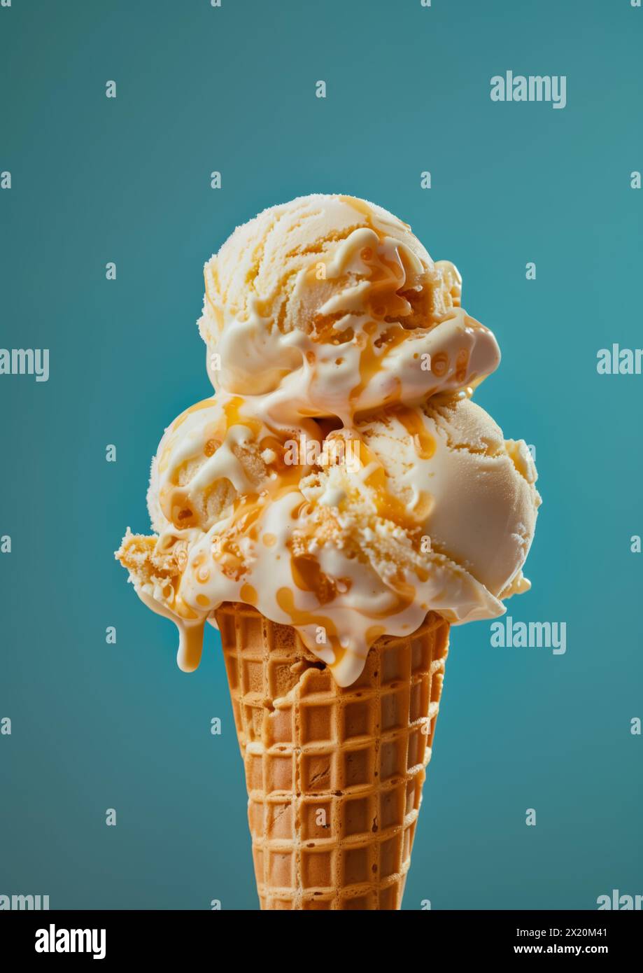 Two scoops of Vanilla ice cream on top ice cream cone blue background ...