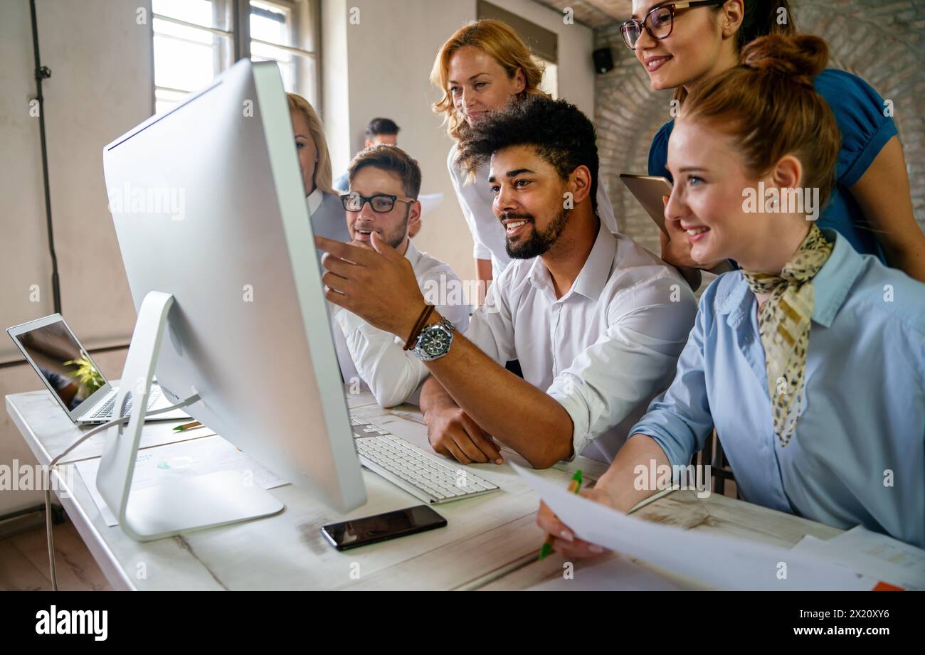 Programmers cooperating at IT company developing apps. Business people technology concept Stock Photo