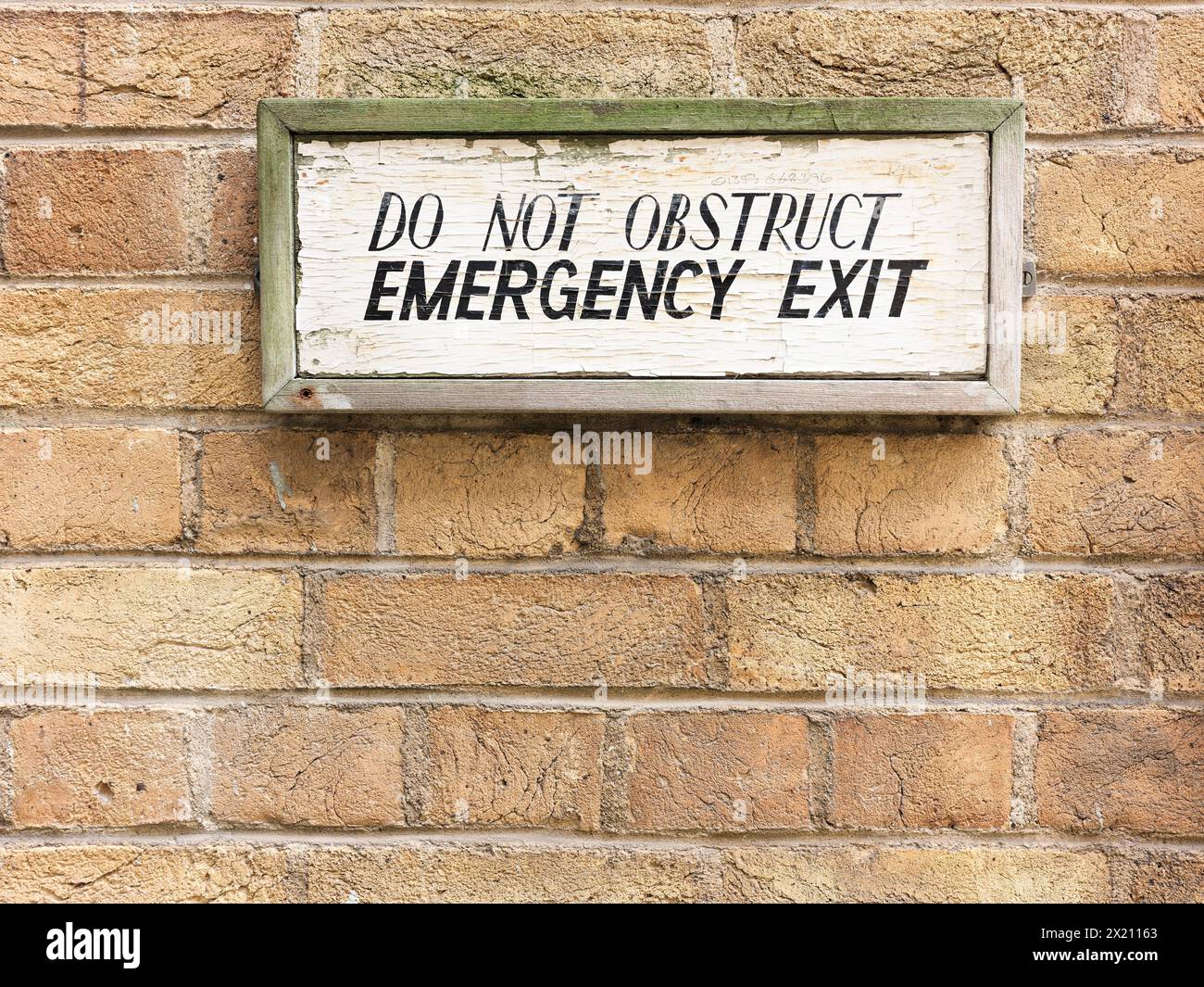 'Do not obstruct emergency exit' notice, New Museums Site, University of Cambridge, England. Stock Photo