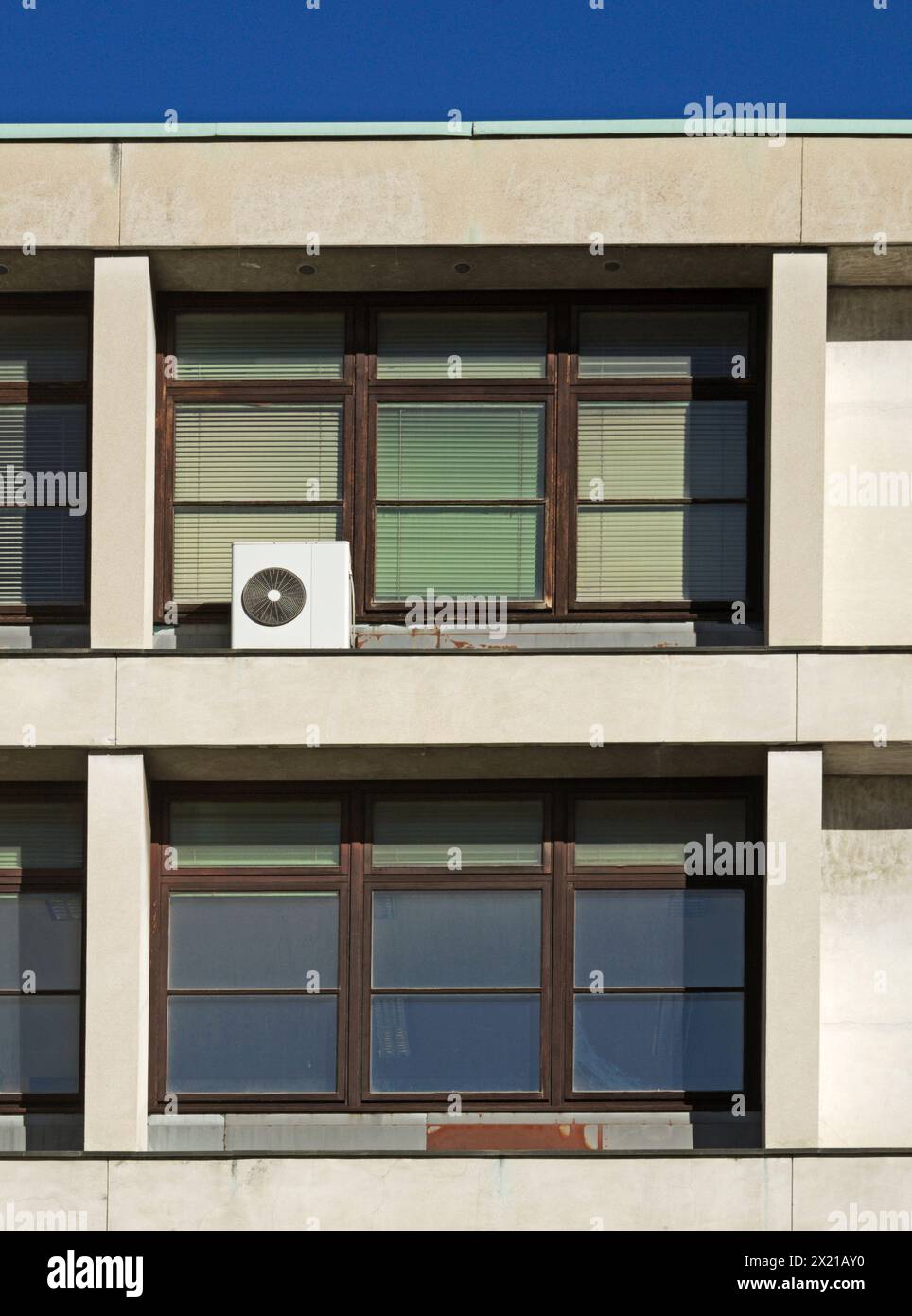 air conditioner outside an office building window, Italy Stock Photo