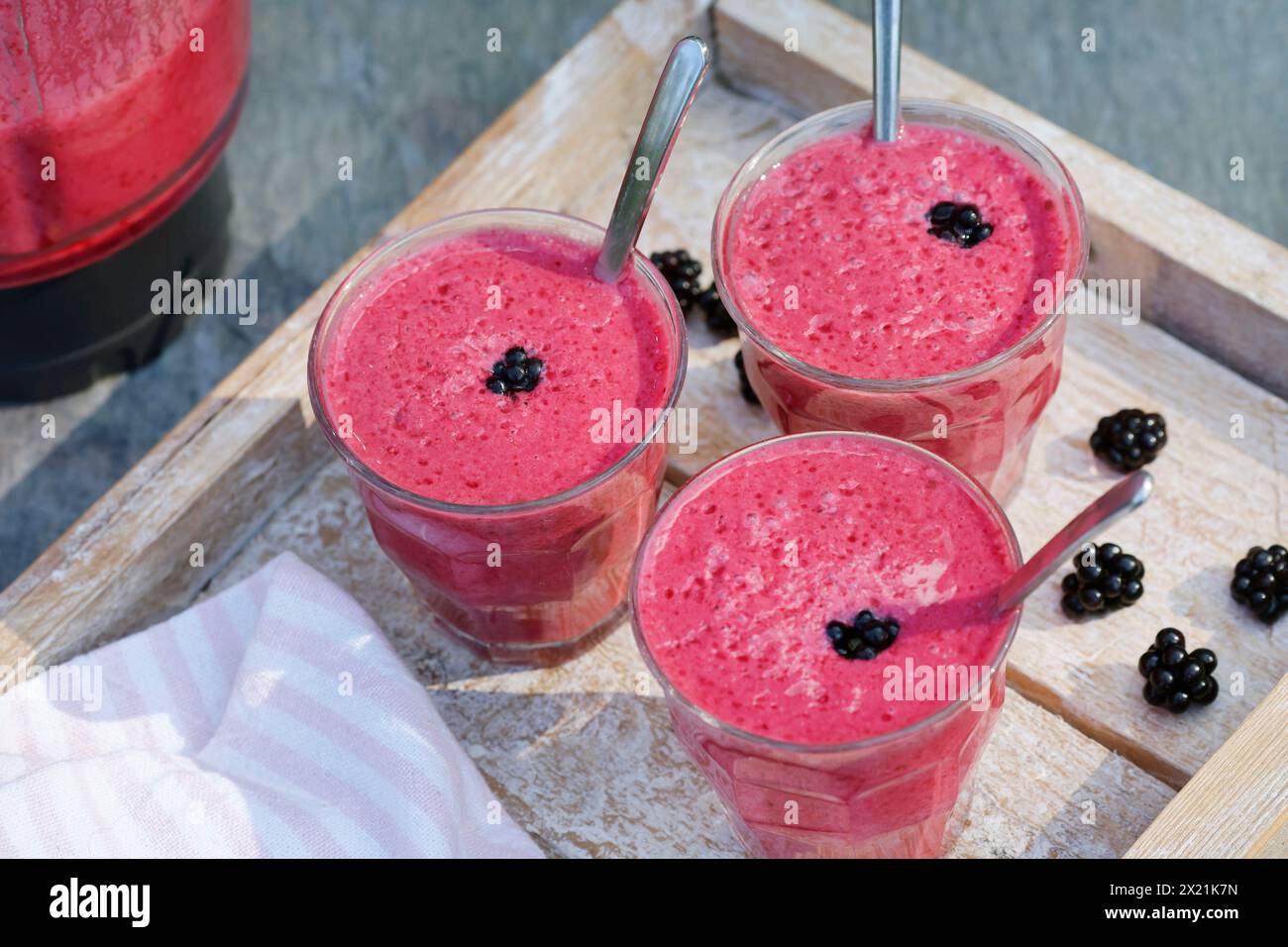 selfmade vegan blackberry milkshake, step 5: ready-made milkshakes, series image 5/5 Stock Photo