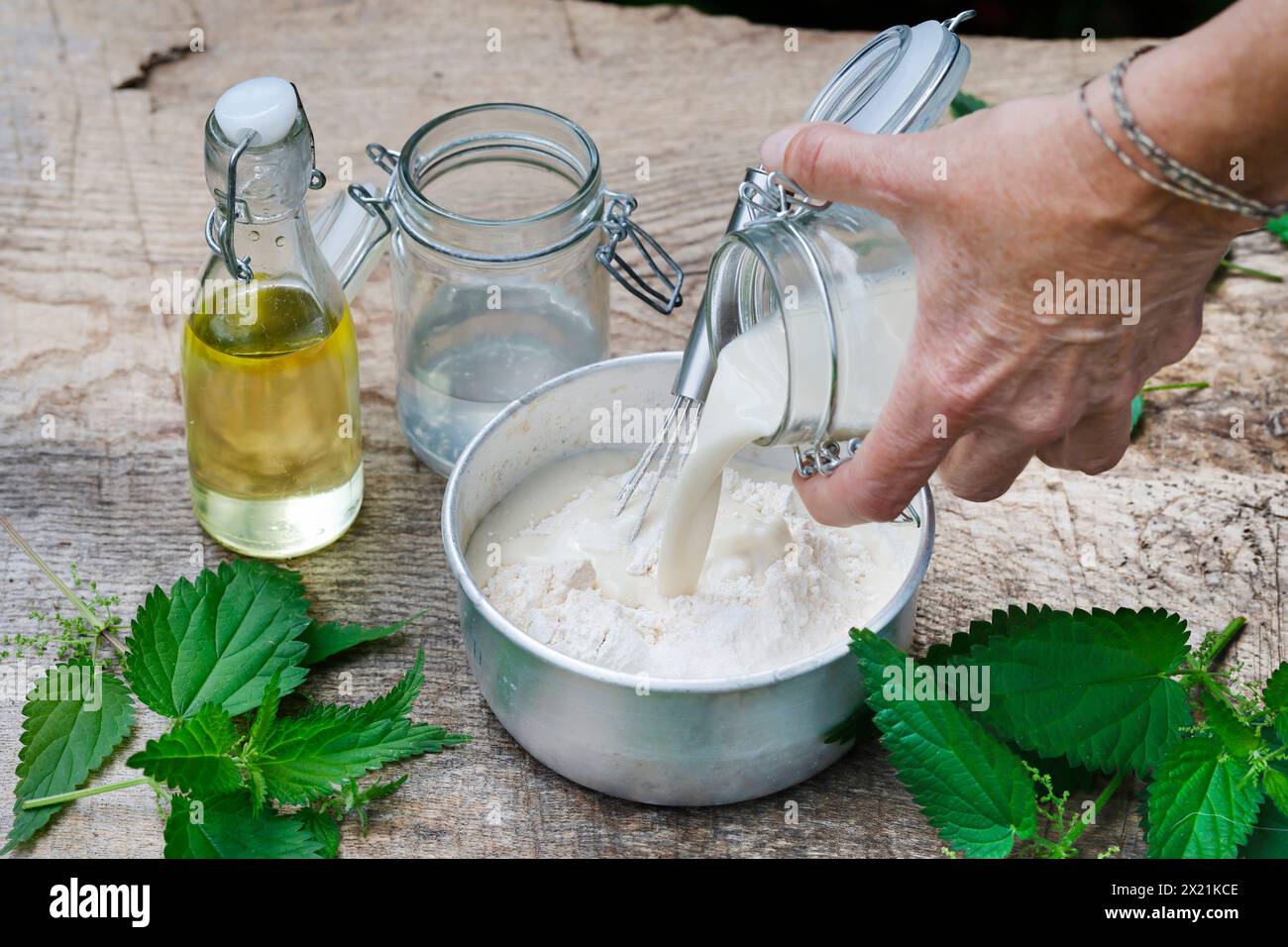 Making vegan plant-based potato chips with nettle leaves, step 2: Pancake batter being prepared, series image 2/5 Stock Photo