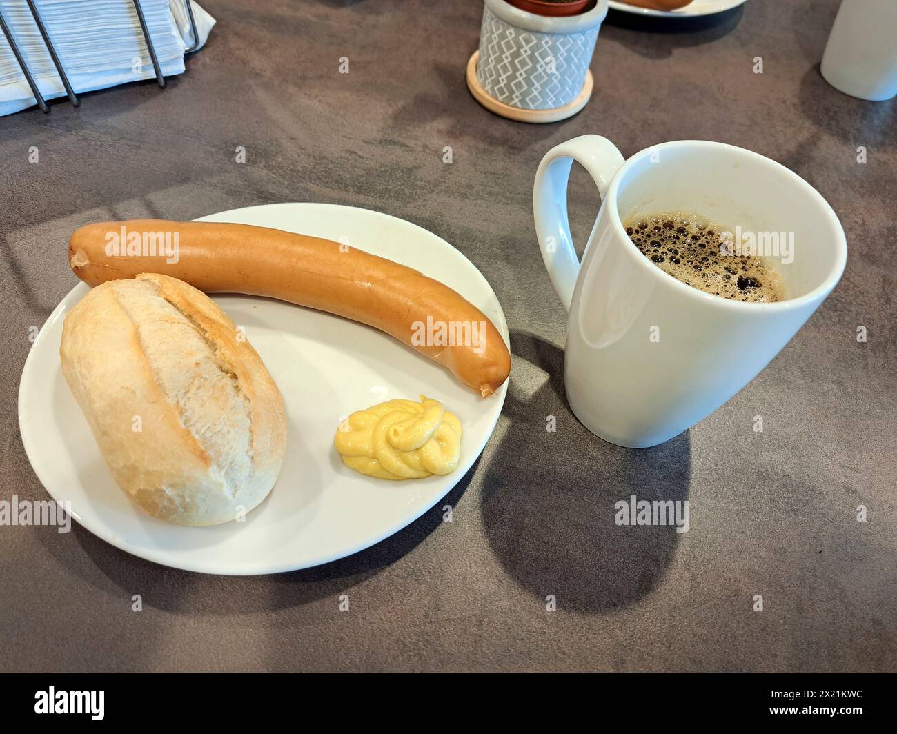 bockwurst with mustard, roll and a cup of coffee, Germany, Brandenburg Stock Photo