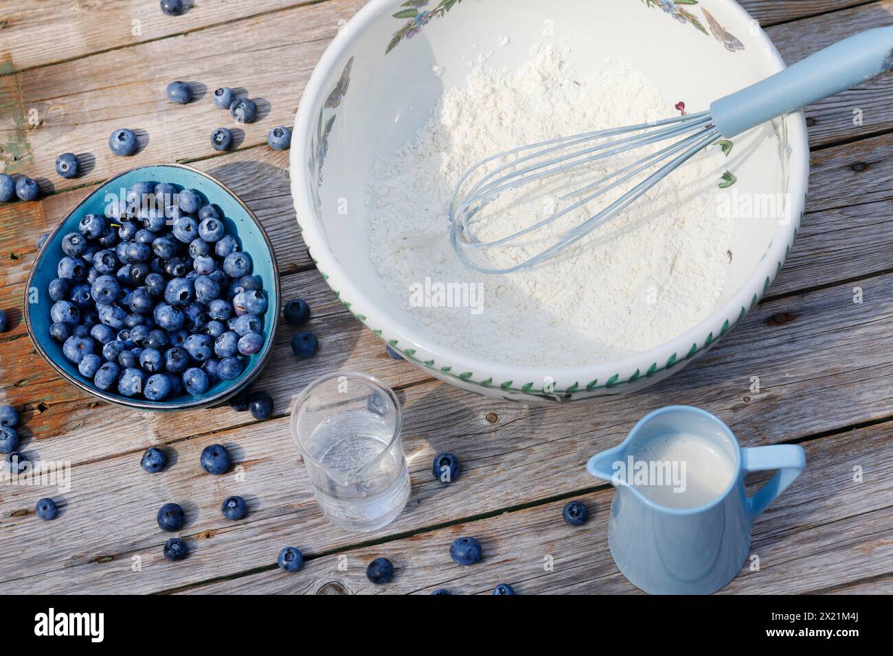 vegan making of Blueberry pancakes, step 1; ingredients: Spelt flour, sugar, salt, baking powder, mineral water, oat milk, blueberries, series image 1 Stock Photo