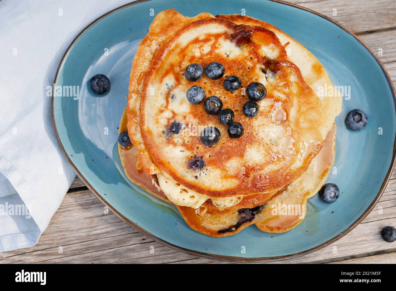 vegan making of Blueberry pancakes, step 5: Ready-made blueberry pancakes are served on a plate, series image 5/5 Stock Photo