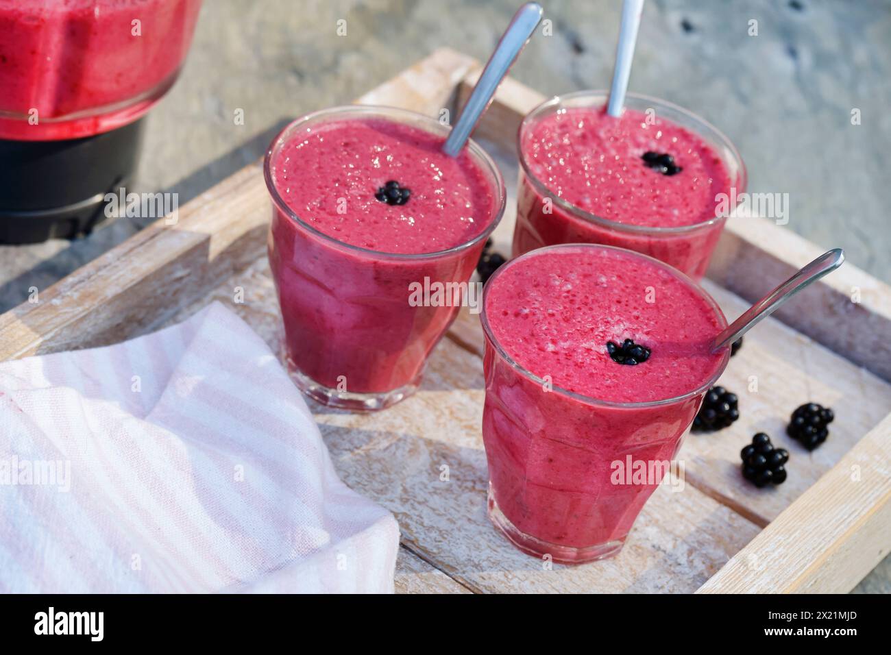 selfmade vegan blackberry milkshake, step 5: ready-made milkshakes, series image 5/5 Stock Photo