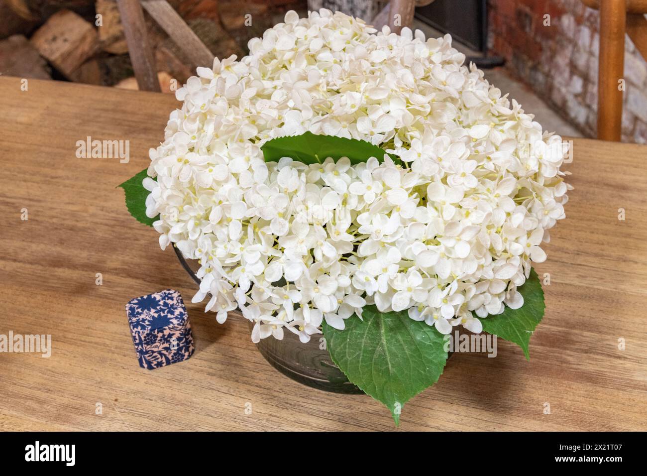 A wedding bouquet with a case of rings on display on a table at Botley Hill Farm in Surrey, UK Stock Photo