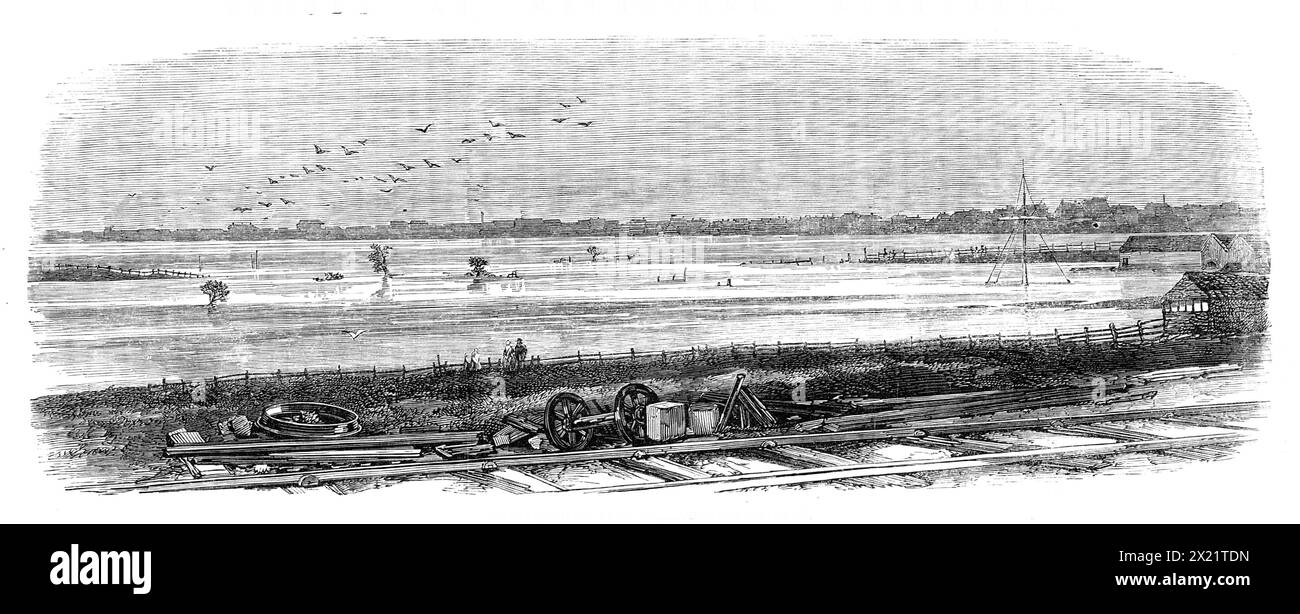 Floods at Melbourne, Australia: Emerald Hill, from the suburban railway, 1864. Engraving of a photograph by Messrs. Davies. 'On Dec. 13 heavy squalls of wind, accompanied by rain, swept across the city, and continued to increase in intensity during the three following days. The wind being from the S.W. and S.S.W., a high tide arose. This, coupled with the heavy rain, had the effect of making the river Yarra rise to a greater height than it had ever done before...All communication with the suburbs was completely cut off during two days. Emerald Hill was an island, the road which connects it wit Stock Photo