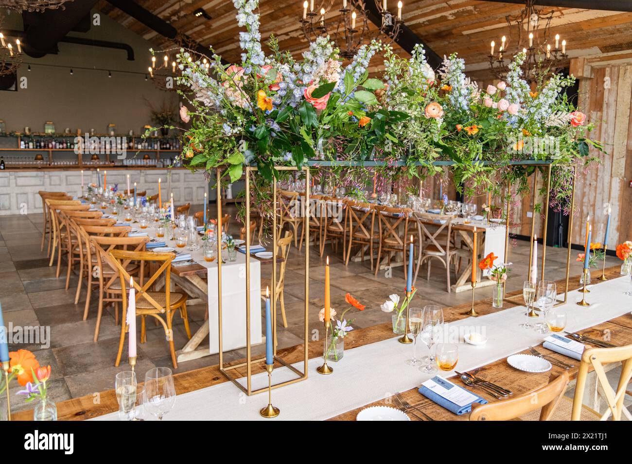 Laid out dinner tables for a wedding reception at Botley Hill Farm in Surrey, UK Stock Photo