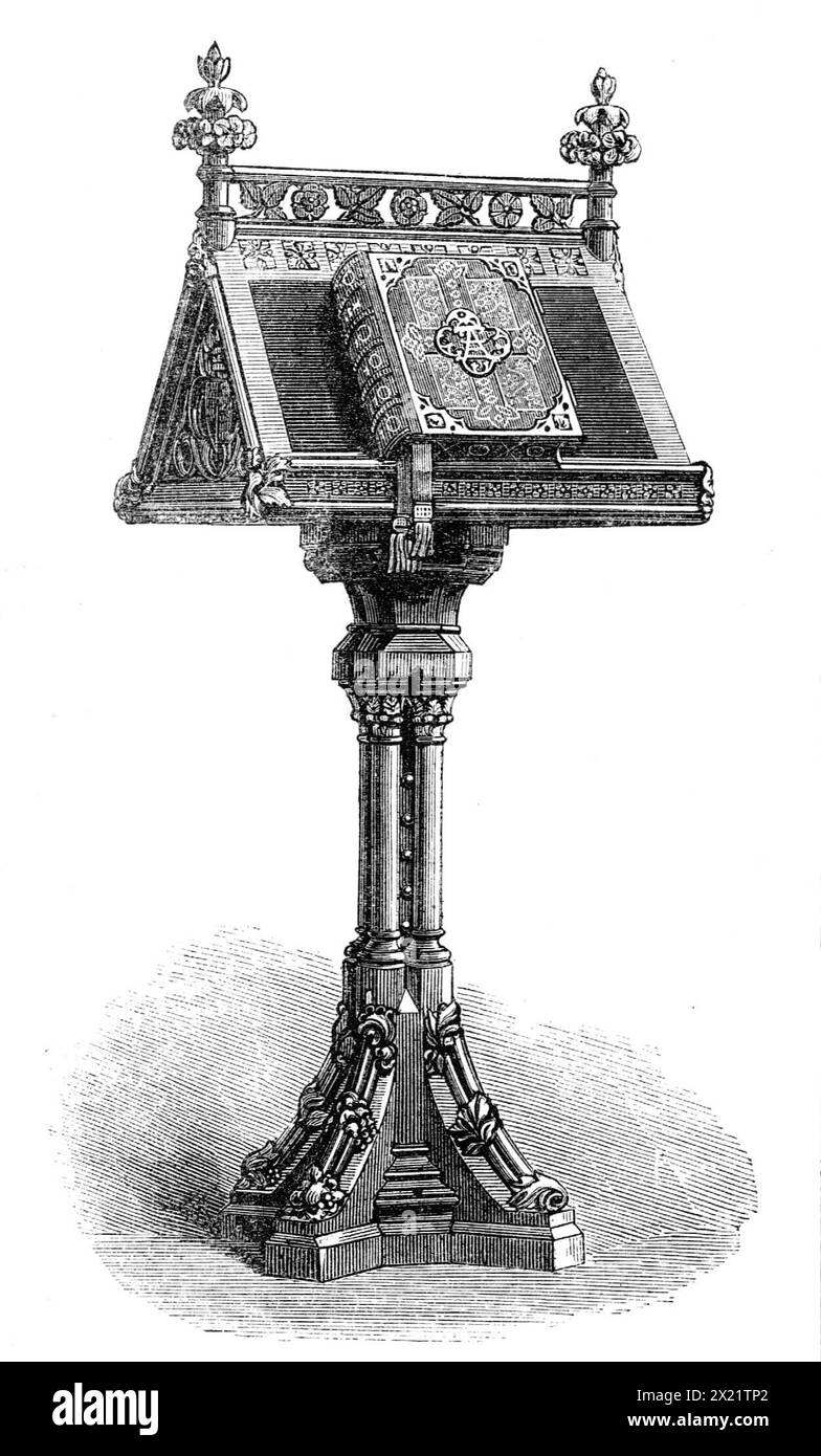 Lectern and Bible presented to the Prince of Wales, 1864. 'We have engraved a photograph of the carved oak Lectern or reading-desk, with the Bible upon it, which were, along with a Common Prayer-book, lately presented to the Prince of Wales by the Earl of Dalhousie, the Earl of Shaftesbury, Lord Charles Russell, the Hon. A. Kinnaird, and other gentlemen, in the name of more than eight thousand subscribers of one shilling each, as a token of their loyal attachment to the son of our Queen, with their earnest congratulations upon his marriage. The deputation, about twenty in number, had an interv Stock Photo