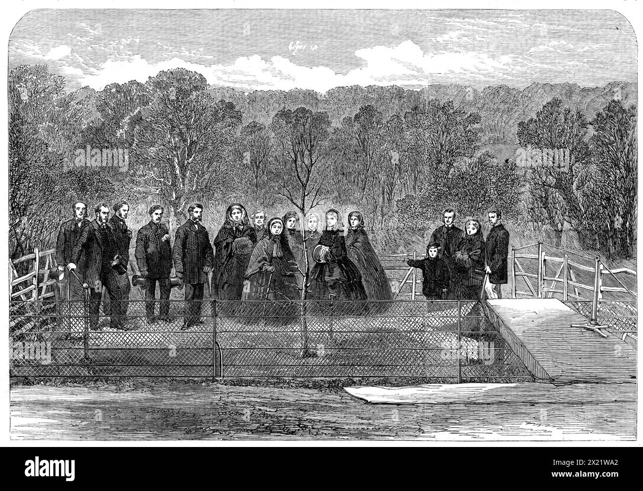 Her Majesty the Queen planting the &quot;Prince Consort's Oak&quot; in Windsor Great Park, 1862. Engraving from a photograph by Mr. Bambridge. 'On Tuesday, the 25th of November last, as our readers are aware, her Majesty planted an oak-tree to mark the spot in Windsor Great Park where the Prince Consort finished his last day's shooting, on the 23rd of November, 1861, just three weeks before his lamented decease. In our Engraving the Queen is represented holding the spade. On her Majesty's left hand stand Princess Alexandra and Princess Louise. Still further to the left, in a detached group, ar Stock Photo