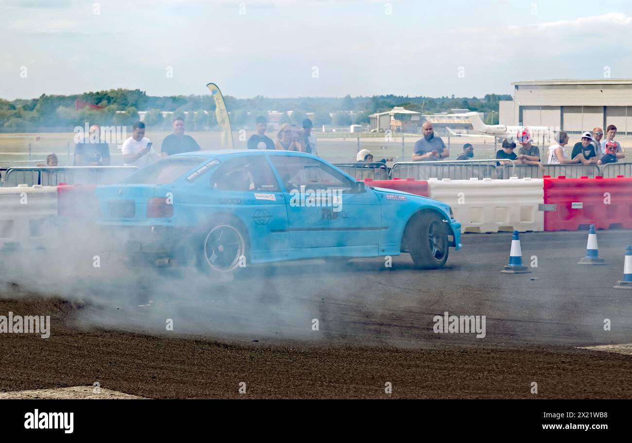 Matthew Holder driving his BMW Drift Car during the Crewsade Drift Show, in the Live Arena,  at the 2023 British Motor Show, Farnborough. Stock Photo