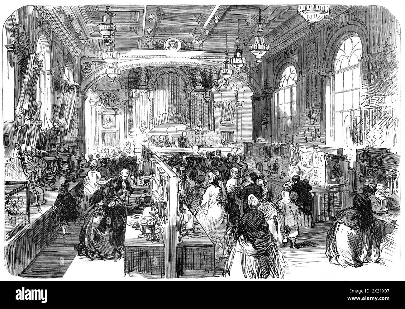Opening of the Reading Industrial Exhibition, 1865. 'This exhibition...is two-fold, being partly an industrial exhibition, made up of specimens of the skill, the taste, and the ingenuity of the working-class people of that town and district; partly a fine-arts loan exhibition, to which many of the nobility and gentry have sent a great variety of precious things...When we mention that out of the 1680 articles catalogued more than 900 come from Windsor Castle and the various seats of the nobility and gentry in the county, some idea may be formed of the richness of the exhibition...The Industrial Stock Photo