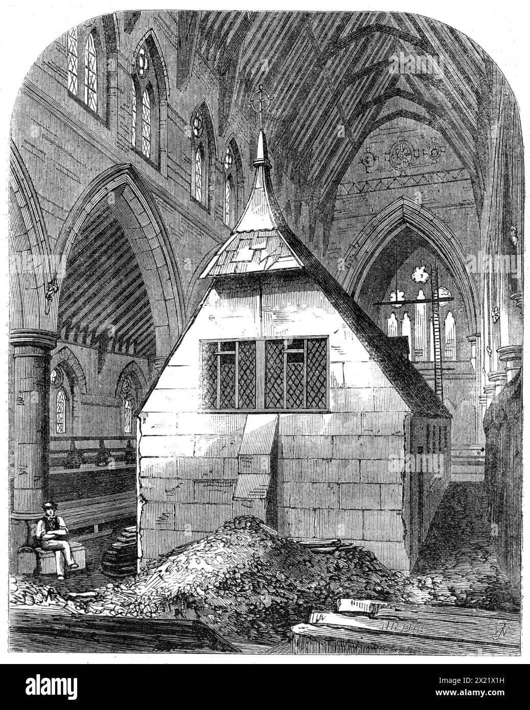 Temporary church within St. Michael and All Angels, Shoreditch, [London], 1865. A '...view of the interior as it appeared a few months ago, while the work of its construction was going on over the temporary building in which the services of the Church have been carried on during the last two years. We believe the only known precedent for this singular expedient of placing the temporary church in the midst of the rising walls of the intended permanent edifice is to be found in the history of the building of York Minster. Architecturally, it is perhaps one of the finest churches lately built in Stock Photo