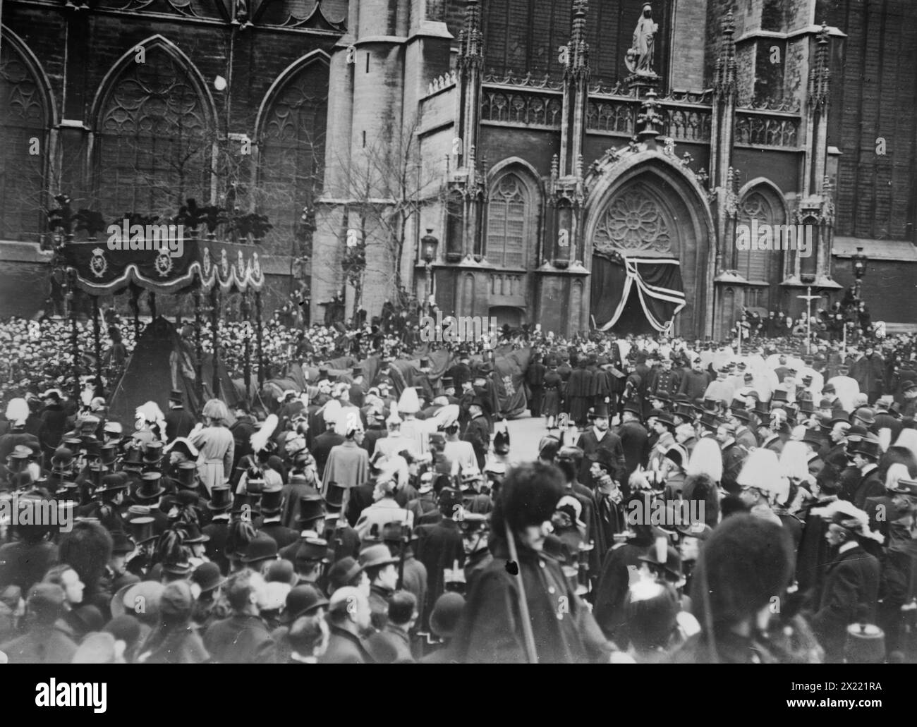 Crowd outside church allowing funeral cortege of King Leopold to pass, Belgium, 1910. Stock Photo